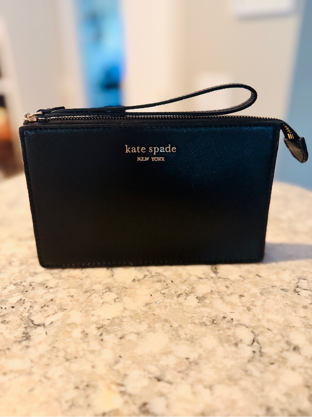 Kate Spade black leather slim pocket wristlet with gold metal logo